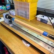 A cue butt mounted in the lathe, ready for work